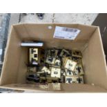 A BOX OF BRASS COLOURED SOCKETA AND LIGHT SWITCHES