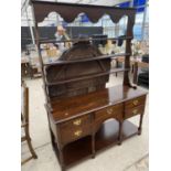 AN OAK DRESSER WITH FIVE DRAWERS AND UPPER PLATE RACK