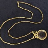 VINTAGE GOLD TONE MAGNIFYING GLASS WITH BOW DECORATION AND CHAIN