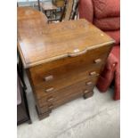 AN OAK CHEST OF FOUR DRAWERS