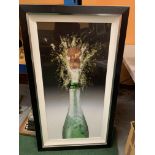 A VIBRANT CHAMPAGNE BOTTLE WITH CORK POPPING FRAMED PICTURE