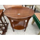 AN OVAL MAHOGANY SIDE TABLE WITH LOWER SHELF