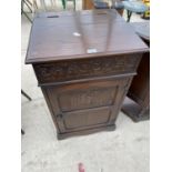 A JAYCEE OAK STEREO CABINET WITH HINGED TOP AND ONE DOOR