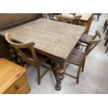 AN OAK DRAW LEAF DINING TABLE AND FOUR DINING CHAIRS