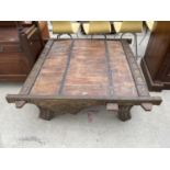 A METAL BANDED INDONESIAN WOOD COFFEE TABLE