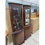 TWO MAHOGANY CORNER CABINETS EACH WITH LOWER DOOR AND UPPER GLAZED DOOR