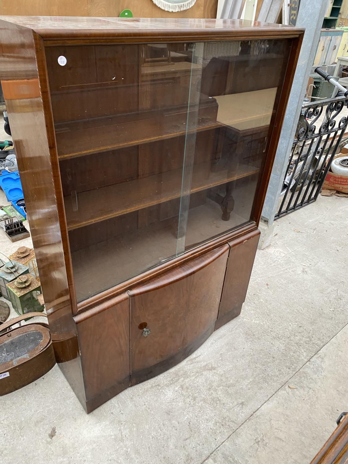 A MAHOGANY CABINET WITH LOWER DOOR AND TWO SLIDING GLASS DOORS