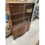 A MAHOGANY CABINET WITH LOWER DOOR AND TWO SLIDING GLASS DOORS