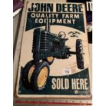 A 'JOHN DEERE SOLD HERE' METAL ADVERTISING SIGN