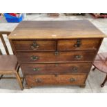 A VICTORIAN OAK CHEST OF TWO SHORT AND TWO LONG DRAWERS