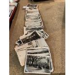 A LARGE QUANTITY OF VINTAGE CIGARETTE CARDS DEPICTING PHOTOGRAPHIC IMAGES