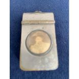 EARLY 20TH CENTURY SILVER PLATED ON BRASS NOVELTY VESTA CASE WITH PORTRAIT TO FRONT, NAME TO REVERSE