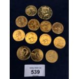 THIRTEEN GOLD PLATED HALF AND QUARTER DOLLAR COINS