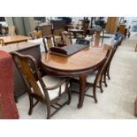 AN ORIENTAL STYLE EXTENDING MAHOGANY DINING TABLE WITH TWO LEAVES TOGETHER WITH FOUR DINING CHAIRS