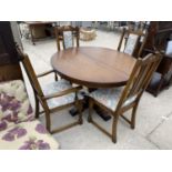 AN EXTENDING OAK DINING TABLE AND FOUR CHAIRS