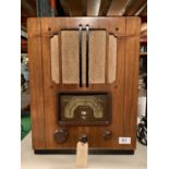 A VINTAGE WOODEN CASED RADIO