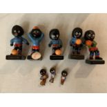 A SET OF FIVE ROBINSONS JAM FIGURES AND THREE PINS