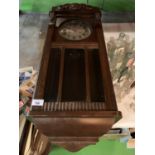 A VINTAGE WOODEN CASED WALL CLOCK