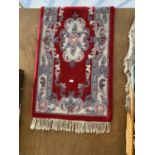 A RED PATTERNED RUG