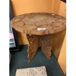 AN ANGLO INDIAN CARVED OCCASIONAL TABLE WTIH BONE INLAY DECORATION