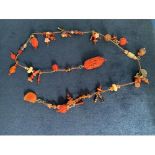 SINGLE STRAND ORIENTAL CARVED CORAL PRAYER BEADS