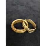 TWO BAND RINGS TWO INCLUDE A BUCKLE RING, SIZES V AND T APPROX TOTAL GROSS WEIGHT 14 GRAMS