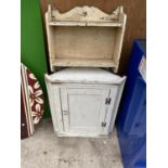 A WHITE CORNER CUPBOARD AND A PAINTED BOOKSHELF