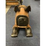 A LARGE WOODEN ROCKING PIG