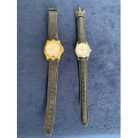 TWO LADIES FASHION WATCHES BOTH WITH BLACK LEATHER STRAP