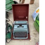 A VINTAGE BRYAN S RYAN LTD OLLIVETTI STUDIO 44 TYPE WRITER IN A CASE