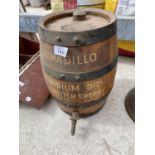A VINTAGE ARMADILLO SHERRY BARREL WITH BRASS TAP