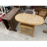 A MAHOGANY DROP LEAF DINING TABLE AND A WICKER TABLE