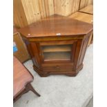 A MAHOGANY CORNER CABINET WITH GLAZED DOOR AND ONE DRAWER