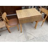 A RETRO DROP LEAF FORMICA TABLE AND TWO CHAIRS