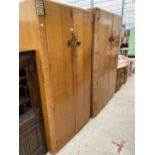A WRIGHTON TEAK THREE PIECE BEDROOM SUITE - TWO WARDROBES AND A DRESSING TAB;E