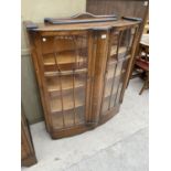 A MAHOGANY CHINA CABINET WITH TWO GLAZED PANEL DOORS