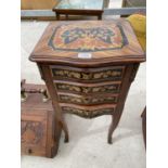 A SMALL ORNATE INLAID MAHOGANY CHEST OF FOUR DRAWERS WITH GILDED DECORATION