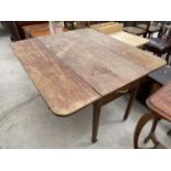 AN OAK DROP LEAF PEMBROKE TABLE WITH SINGLE DRAWER