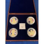 A BOXED SET OF FOUR LARGE COINS DEPICTING 1936 THREE KINGS