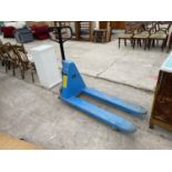 A 1000 KILO PALLET TRUCK - IN WORKING RIDER