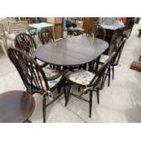 A JAYCEE OAK DROP LEAF DINING TABLE WITH FOUR MATCHING CHAIRS AND TWO CARVERS
