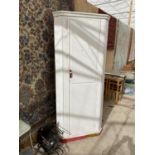 A WHITE PAINTED CORNER WARDROBE