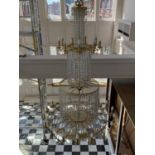 A VERY LARGE CHANDELIER - THE IMAGES SHOW THE ITEM IN SITU AND NOW PACKAGED IN A WOODEN TRANSIT BOX.