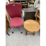 A SMALL PINE COFFEE TABLE AND A RED OFFICE CHAIR