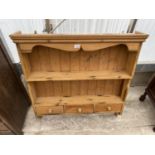 A PINE KITCHEN WALL RACK WITH THREE LOWER DRAWERS