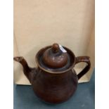 A LARGE TREACLE GLAZE TEAPOT