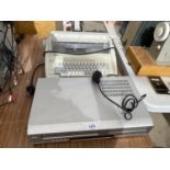 A BROTHER ELECTRIC TYPEWRITER AND A DVD/VRC PLAYER