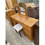 A PINE DRESSING TABLE WITH STOOL AND THREE SECTION DRESSING MIRROR