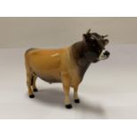 A BESWICK JERSEY BULL DUNSLEY COYBOY