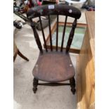 A CHILD'S VICTORIAN HIGH BACKED OAK CHAIR